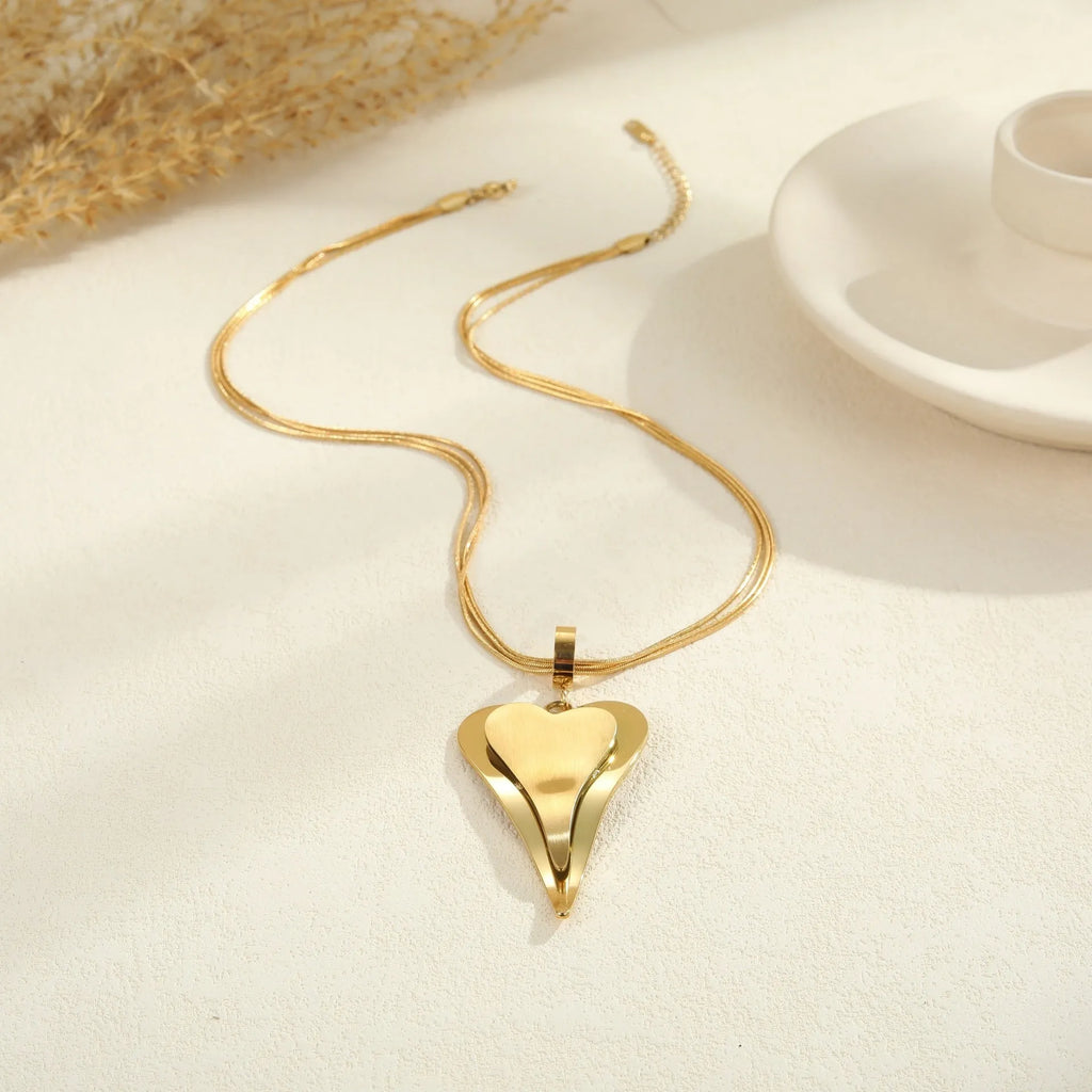 Stainless steel necklace with double heart pendant and snake bones chain design