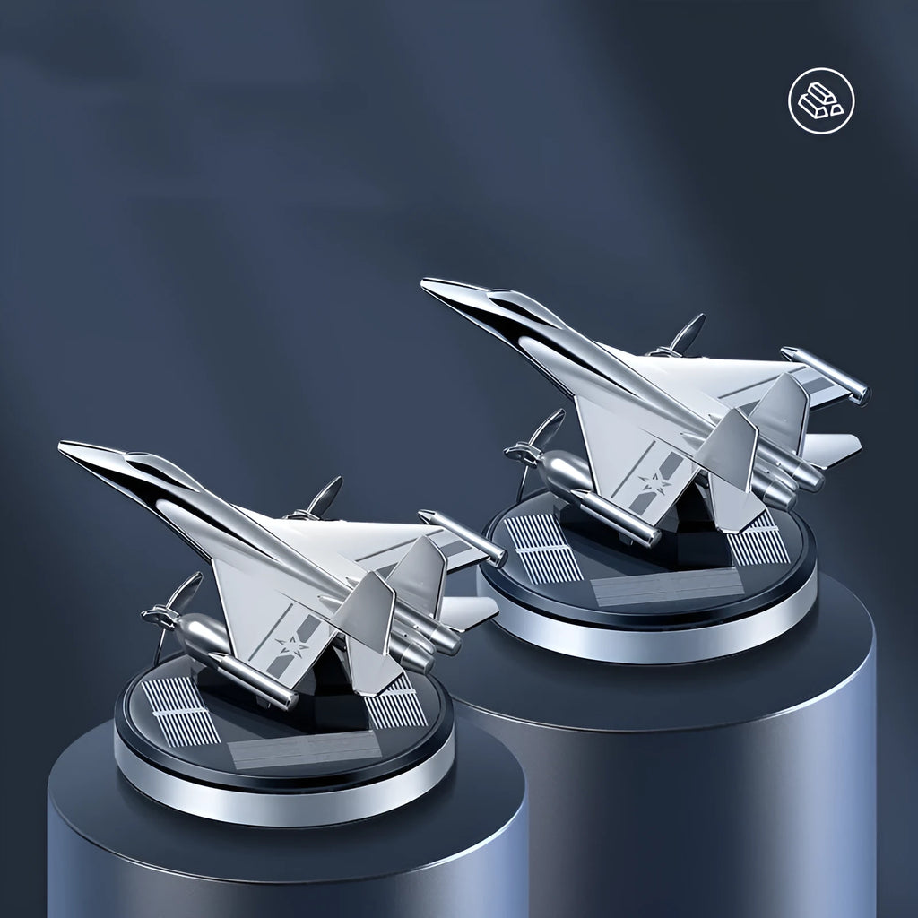 Silver solar powered rotating fighter jet perfume ornament on car dashboard with aluminium alloy construction