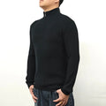 Man wearing a grey half-turtleneck zip-front casual sweater