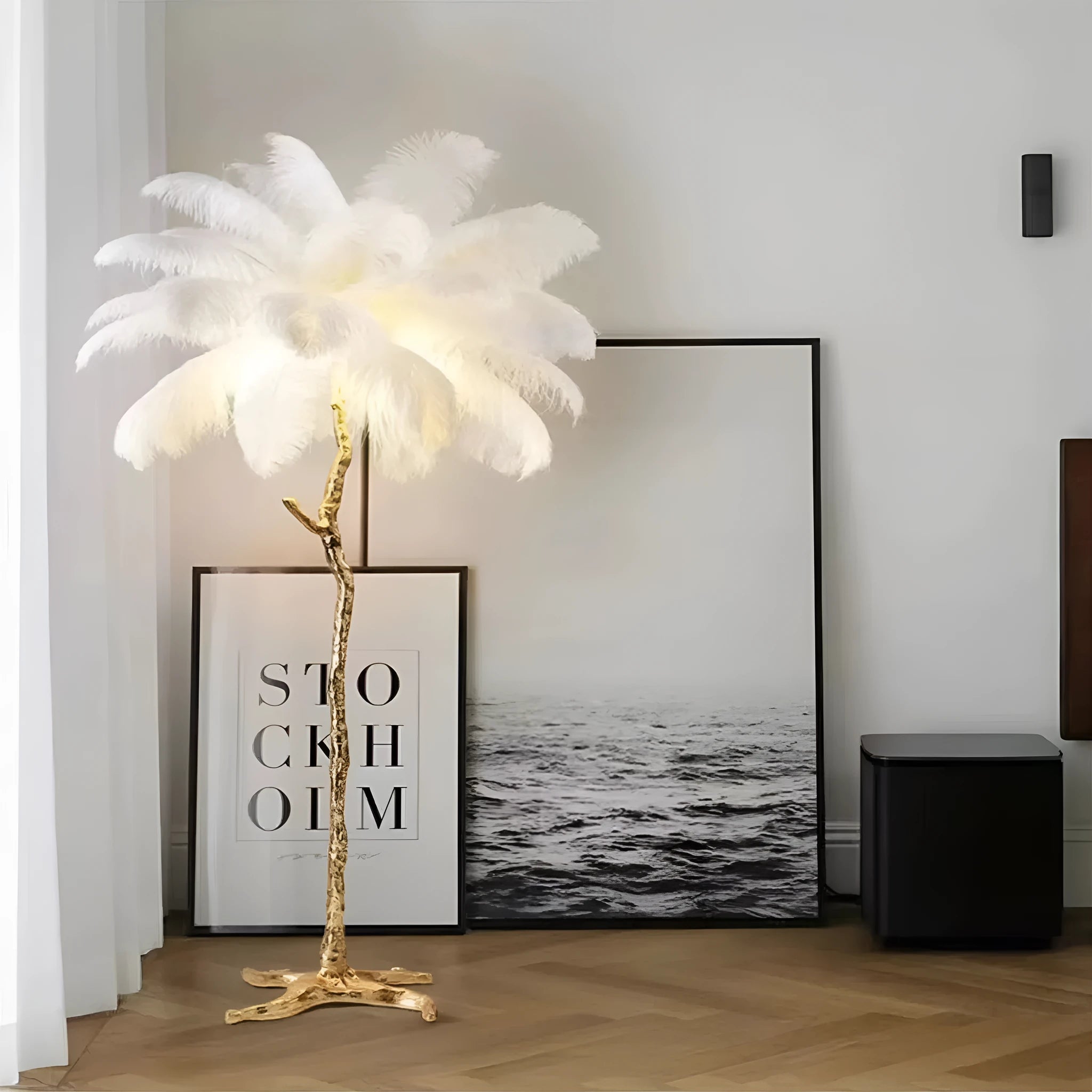 Tall white resin feather floor lamp standing in a modern living room.
