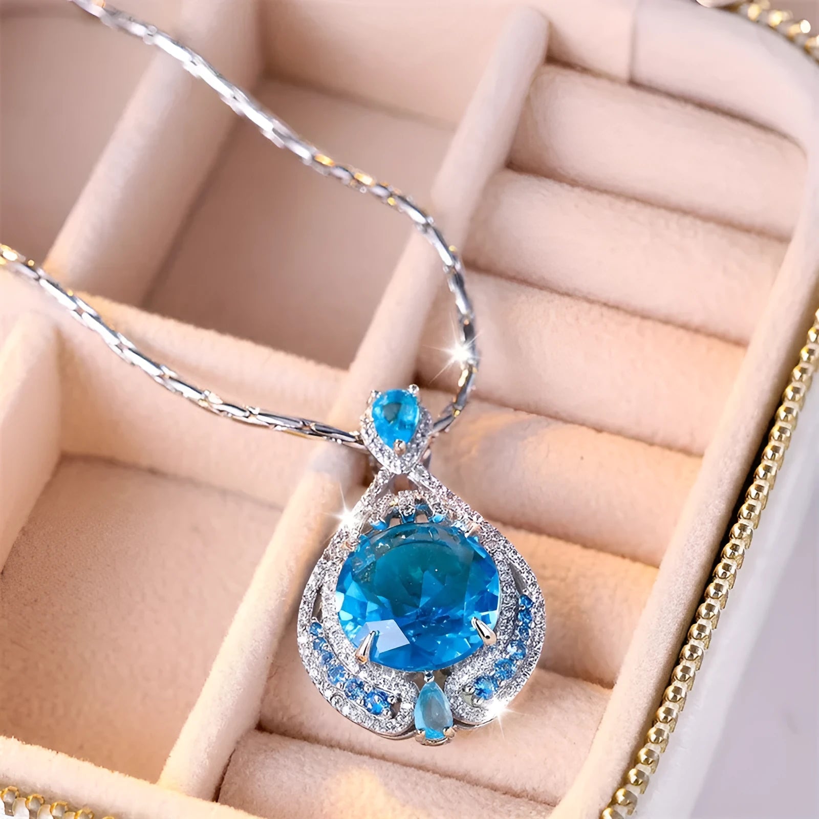 Blue fireworks-cut gem geometric pendant necklace on water wave chain for women