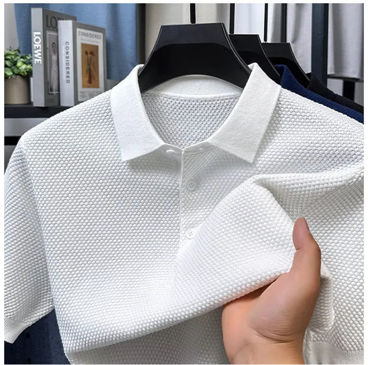 Loose pure cotton short sleeve pullover sweater in grey, shown laid flat.