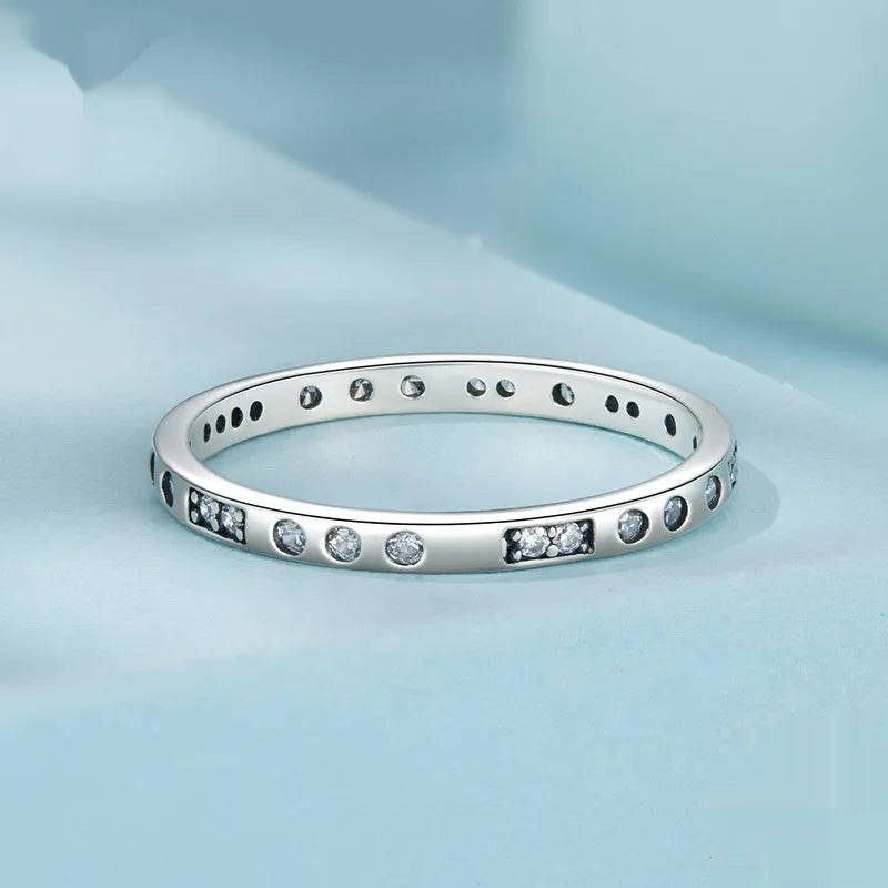 SCR1157 Moss Password I Love You oxidised black silver ring on a hand, showing simple bracelet style.