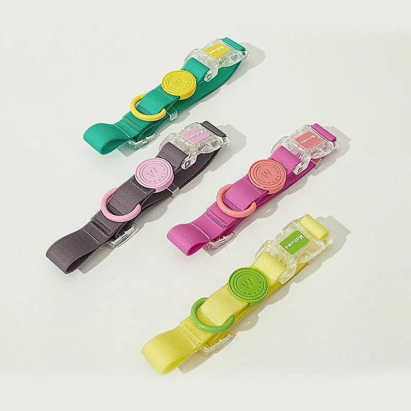 Nylon dog collar and hand holding rope set in smoky gray, new green, lemon yellow, and rose pink