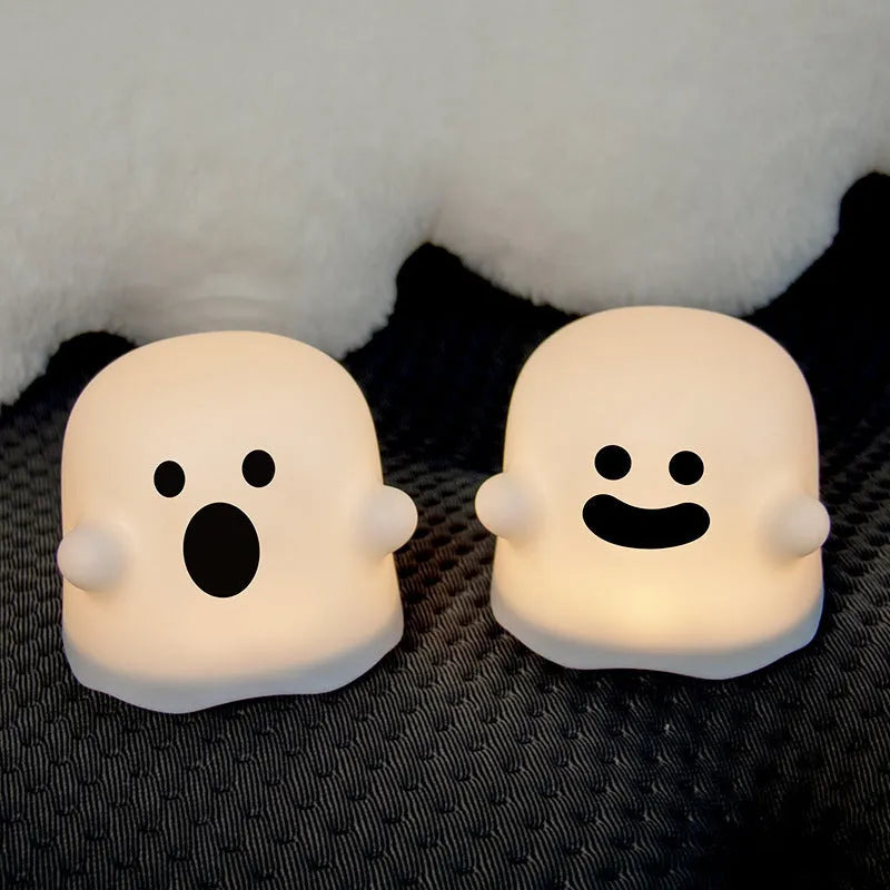Silicone night light in Ah Ah style on a bedside table with soft glow