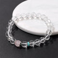 Natural white crystal lucky fortune bracelet with 8mm beads on a white background