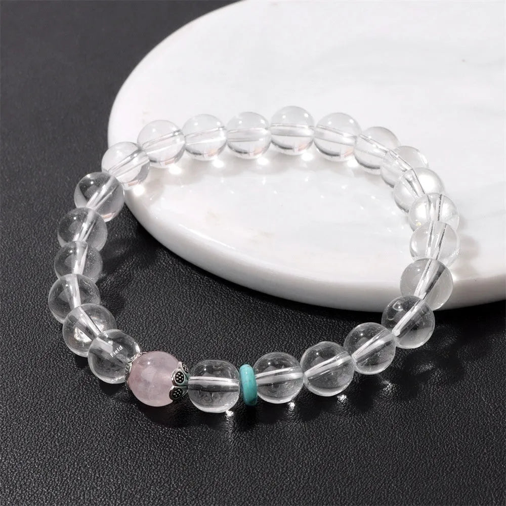 Natural white crystal lucky fortune bracelet with 8mm beads on a white background