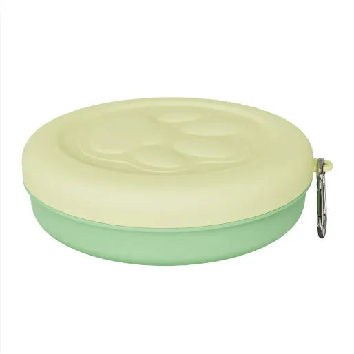 Collapsible portable dog food and water bowl with separate lid, shown in light green.