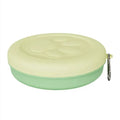 Collapsible portable dog food and water bowl with separate lid, shown in light green.