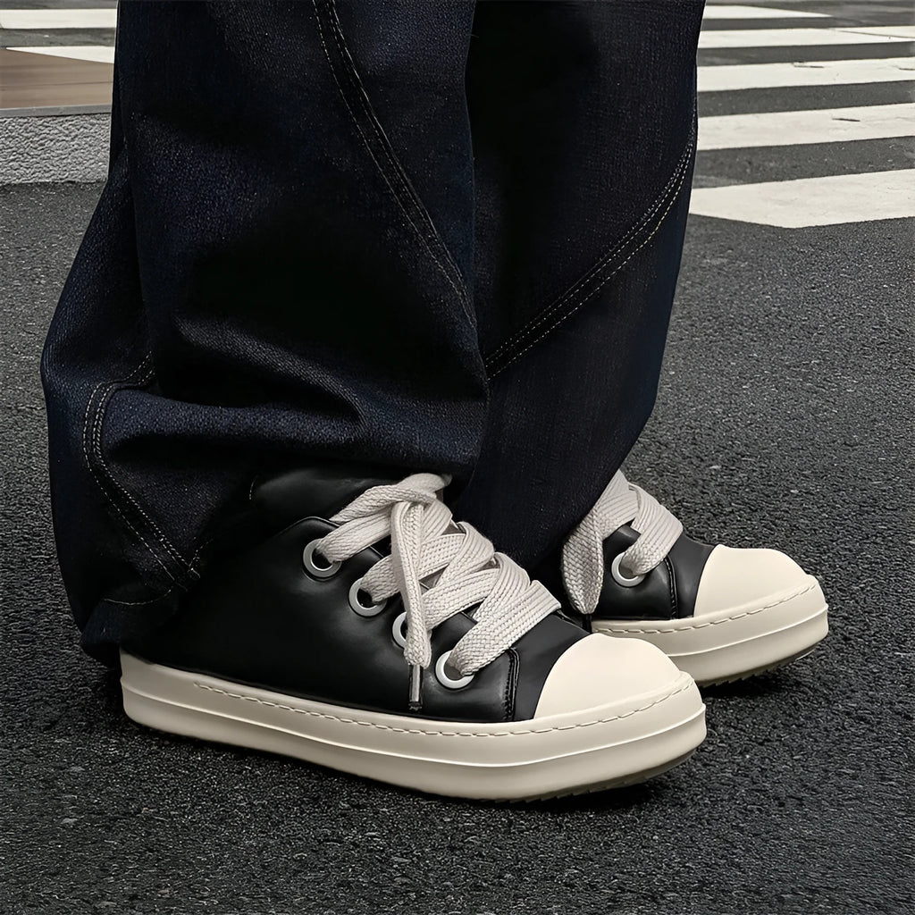 Men's black leather low-top slip-on casual shoes with raised bottom board, round toe, and front lace-up