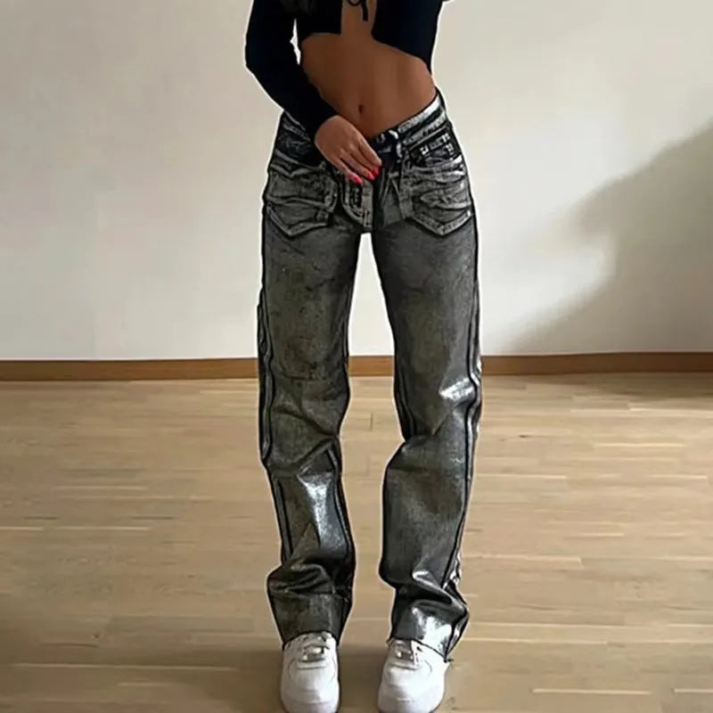 Women's high waist straight leg jeans in washed blue denim with hot silver contrast details