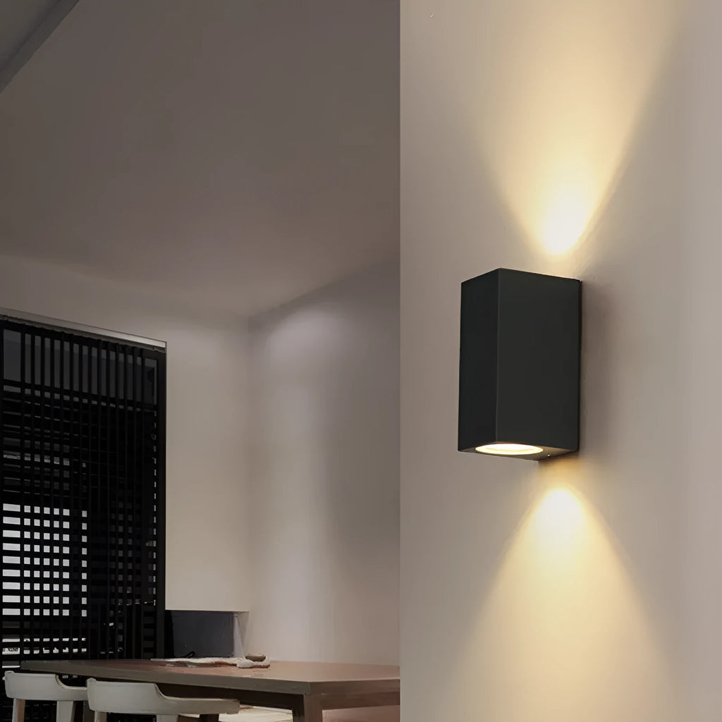 Modern aluminium and glass LED wall lamp in a black finish with silicone rubber trim.
