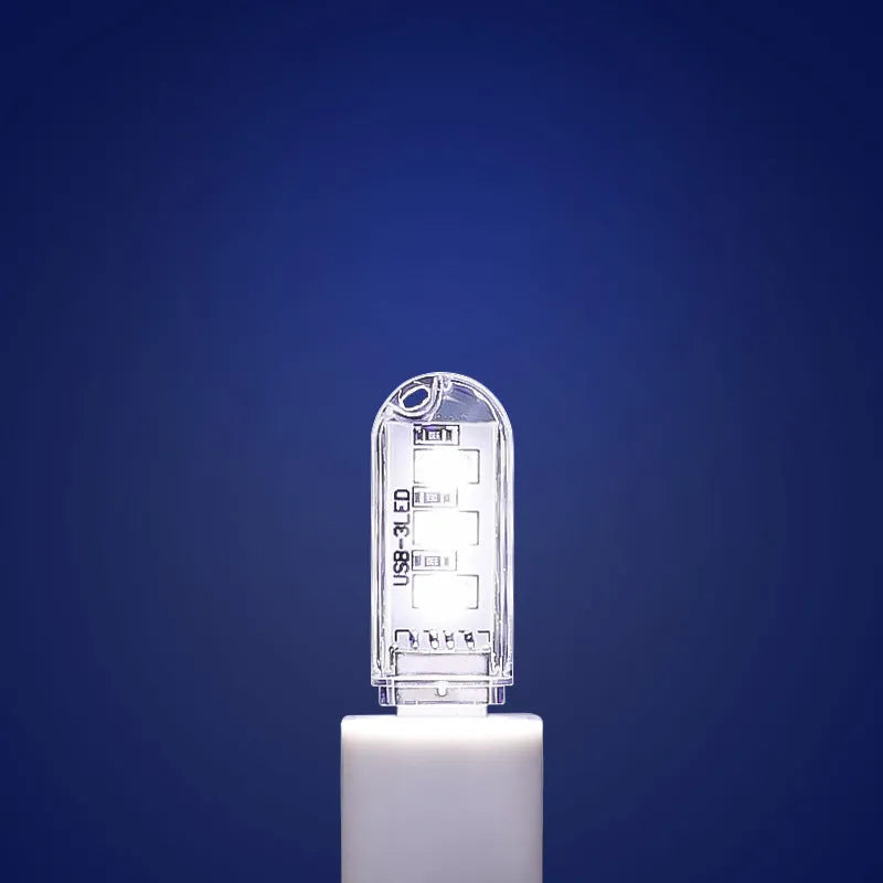 Small white USB LED night light for baby nursery with white and warm light settings.