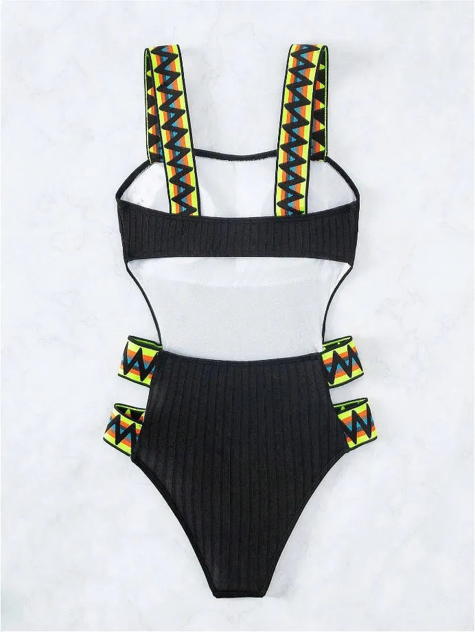 Solid colour women's one-piece polyester swimsuit on a model, available in black and orange.