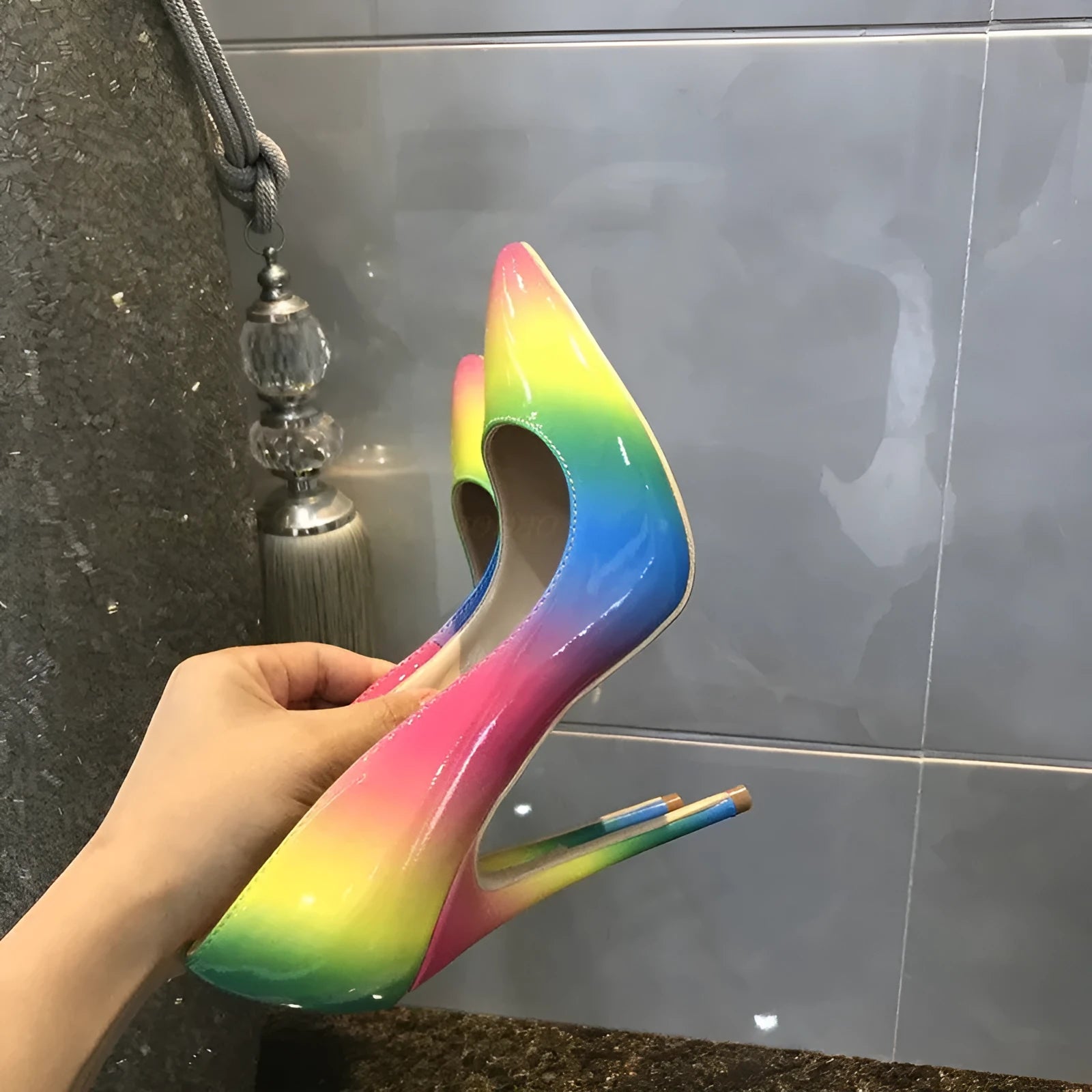 Rainbow patent leather women's ultra-high heel pointed toe stiletto pump shoes on white background