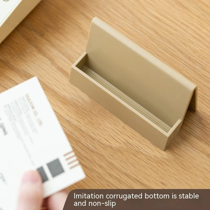 Creative business card storage display stand in geometric PS material, holds 20 cards, available in six colours