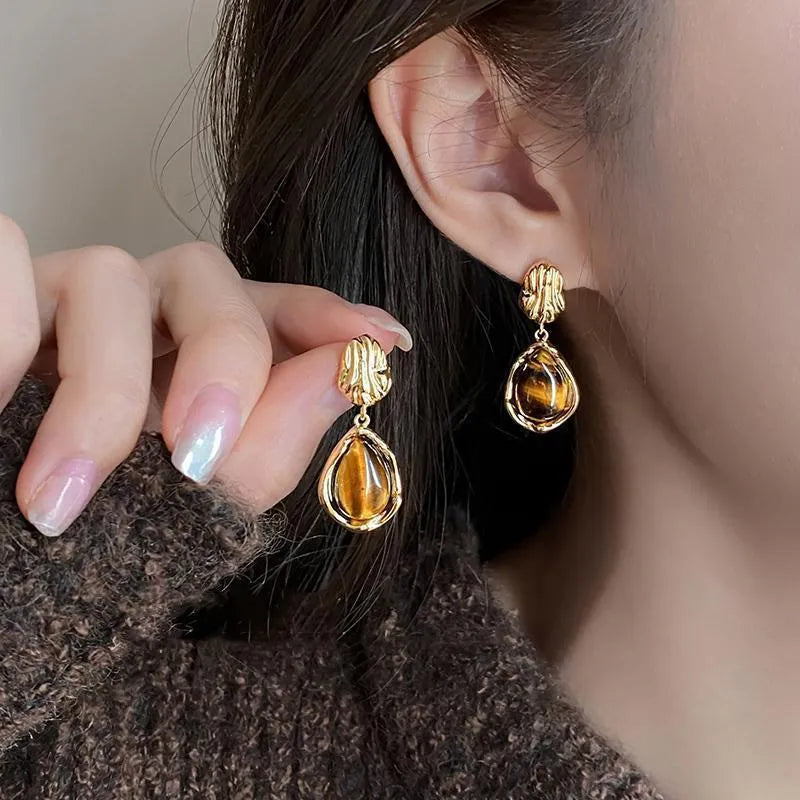 Three pairs of handmade geometric holiday earrings with tassel elements in alloy with electroplating treatment