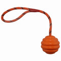 Rubber dog chew ball with rope knot measuring 6x30cm in blue, orange, red and yellow colours