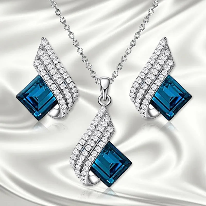Women's electroplated alloy necklace and earrings set with glass detail and cross chain style