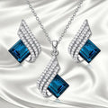 Women's electroplated alloy necklace and earrings set with glass detail and cross chain style