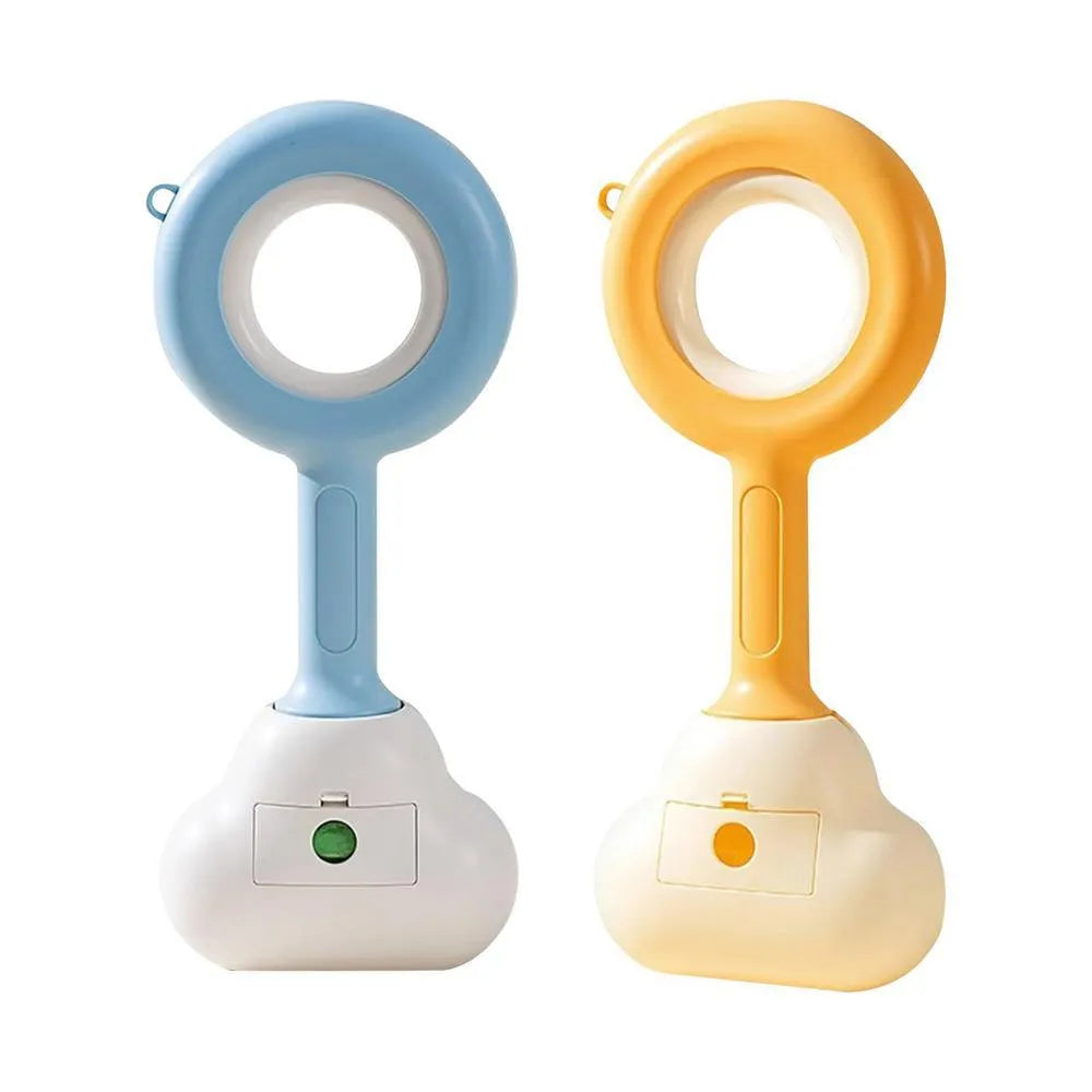 Pet dog pooper scooper with cloud shape jaw in blue colour on grass