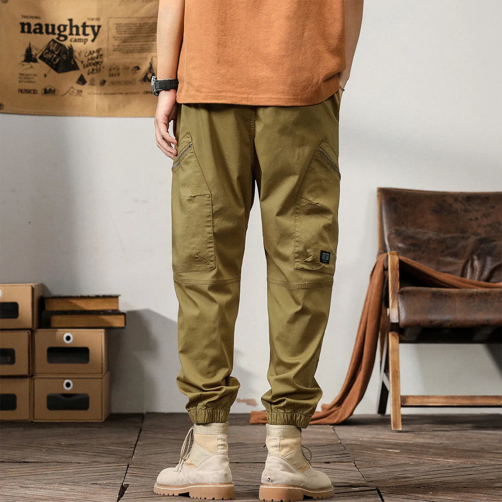 Men's tapered harem pants in cotton fabric with ankle banded legs and Hong Kong retro style