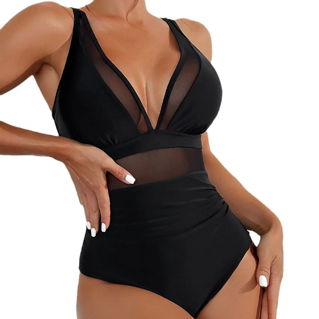 Black women's one-piece swimsuit with halter neck and mesh fabric panelling.