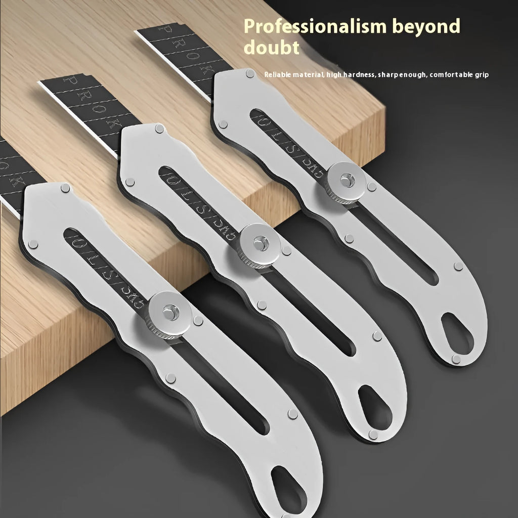 Stainless steel folding art knife with black blade, showing open position on work surface