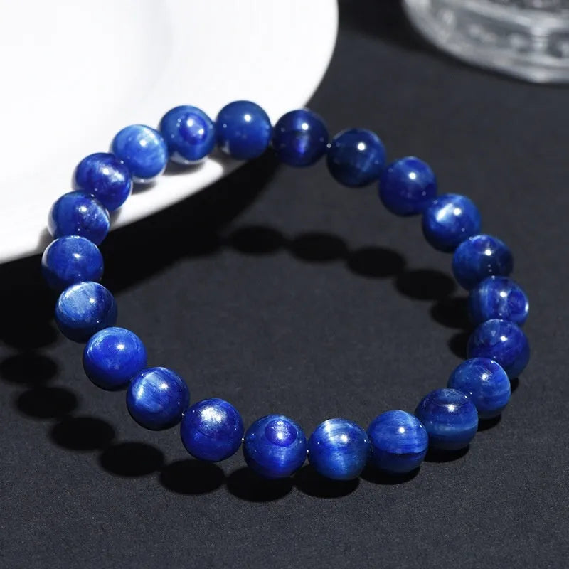 Blue crystal bracelet with geometric shape and Ruyi design element on wrist
