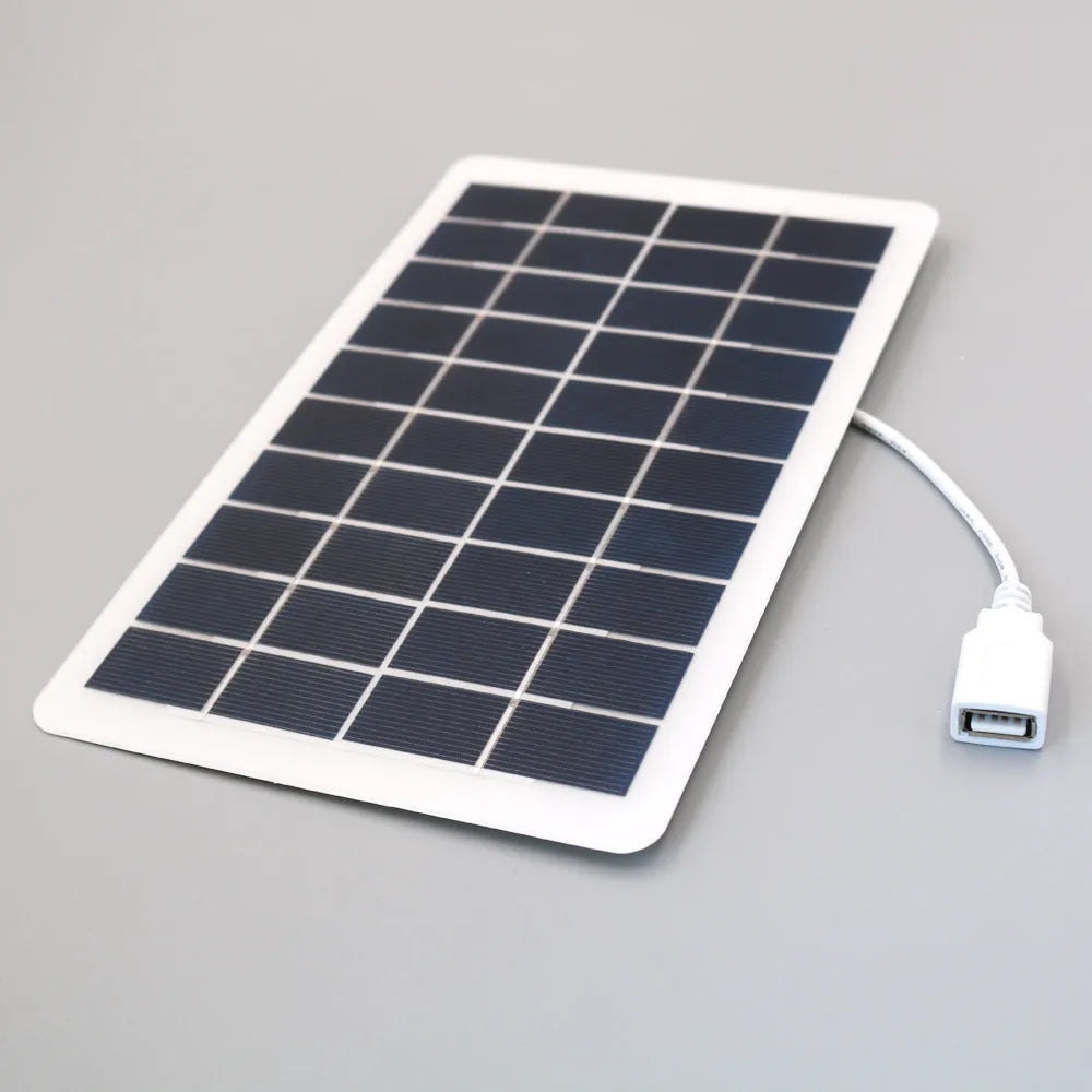 Black portable solar panel mobile phone charger with USB output and PET grinding treatment
