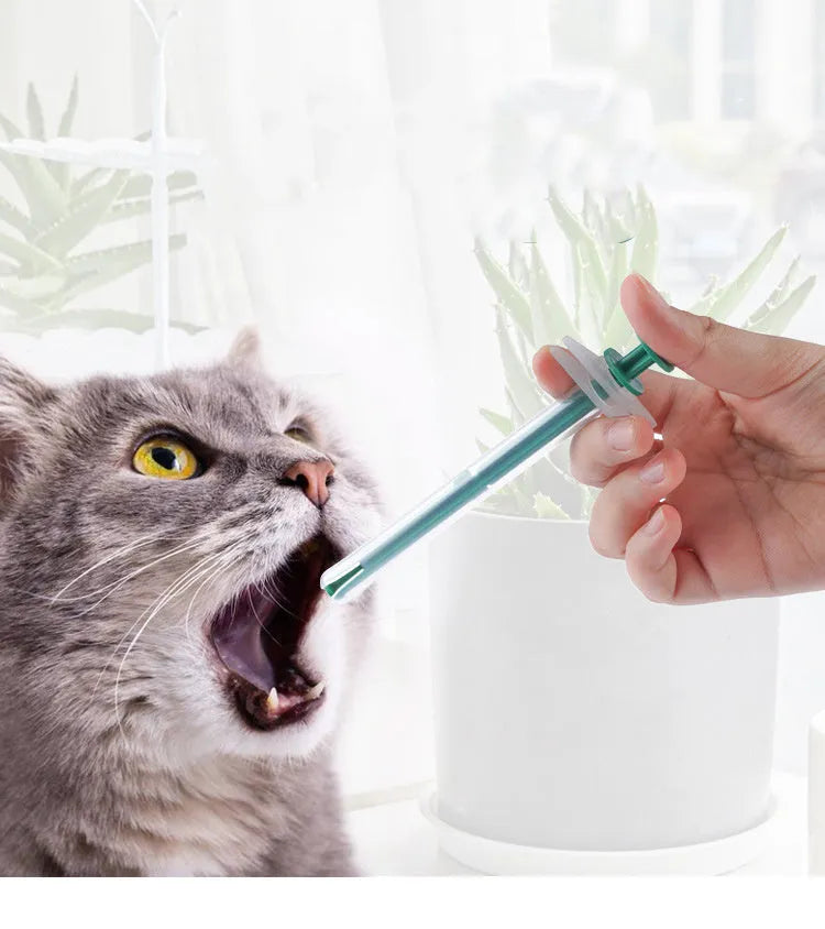 Two pet pill shooter guns with soft silicone tips in different sizes for cats and dogs