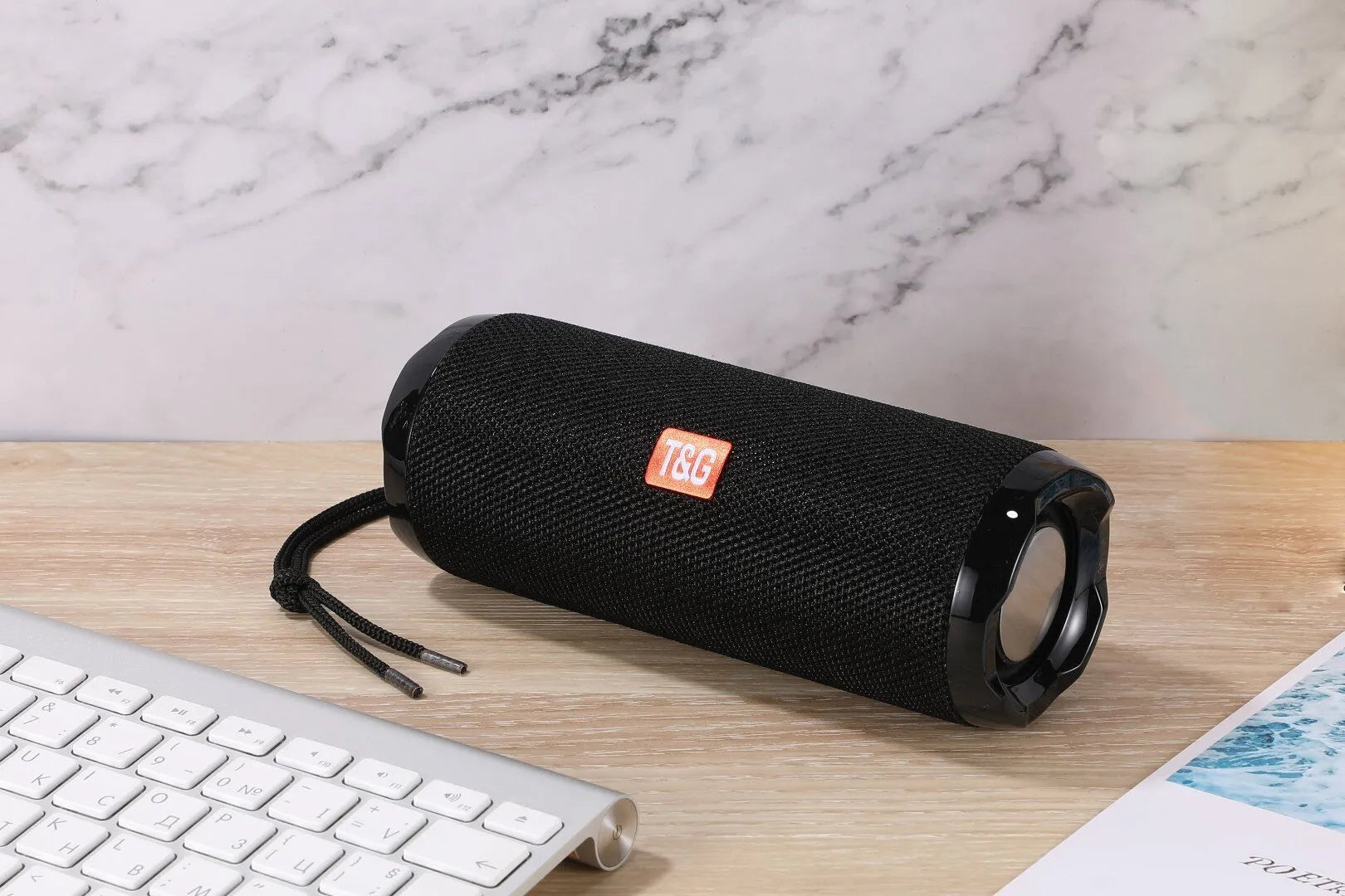 Fabric-covered portable Bluetooth speaker with integrated card holder in multiple colour options
