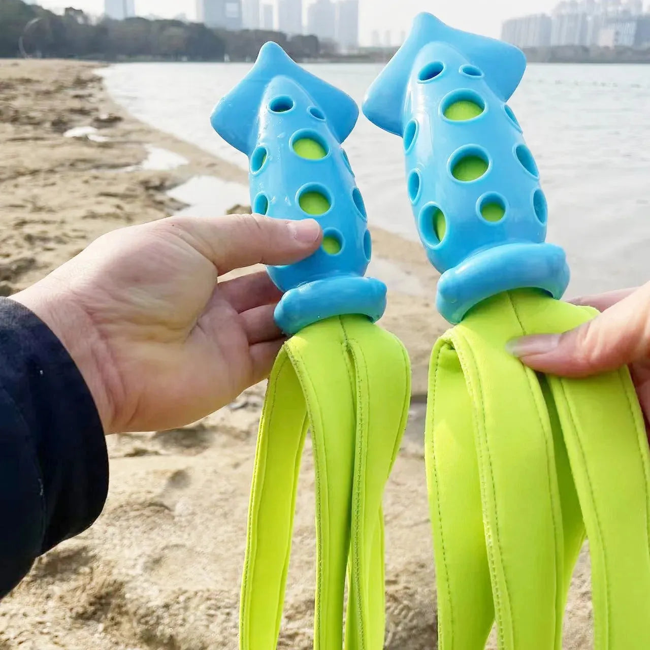 Blue dog chew toy shaped like a cuttlefish with squeaker for teeth cleaning and interactive play