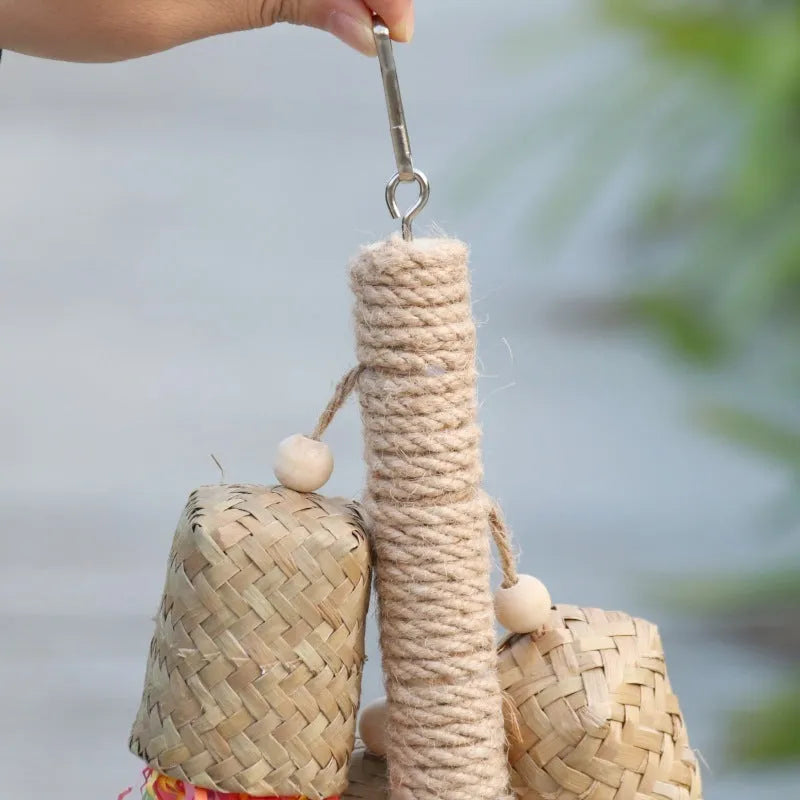 Colourful shredded paper and wood parrot hanging toy with sisal rope, 15 by 35 cm
