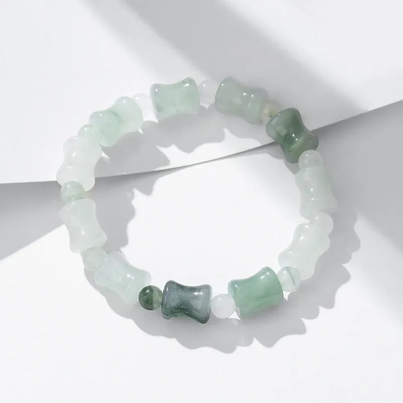 Tianshan Emerald natural chalcedony beaded bracelet with diamond jade centre and coconut shell beads on a white background