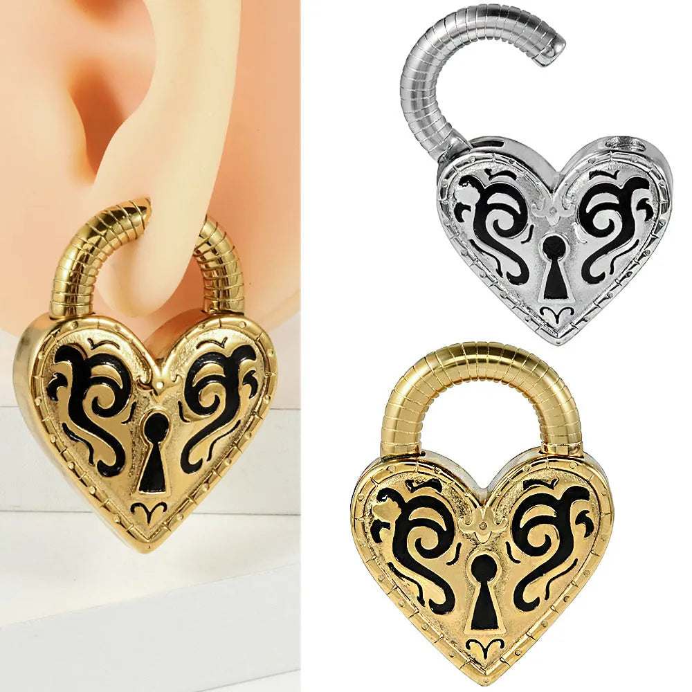 Close-up of a women's stainless steel heart-shaped earring with an electroplated gold colour finish.