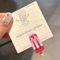 Cartoon ice cream resin barrette side clip for women in beige colour with ice candy design