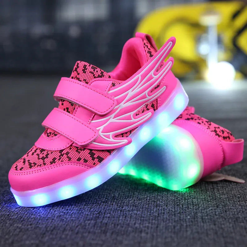 Children's plum red and white LED light up sneakers showing USB charging port and lights illuminated.