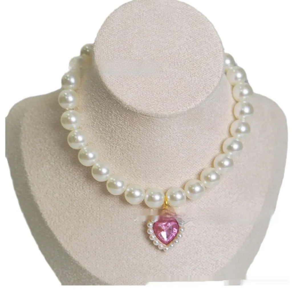 Pearl love gem cat collar in pink on a cat, plastic alloy resin pendant with monochrome design