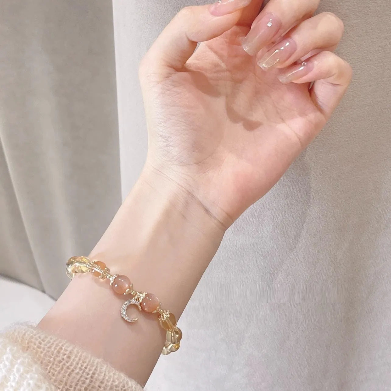 Chinese style crystal bracelet with 14K gold electroplating and citrine moonstone beads in diamond shapes
