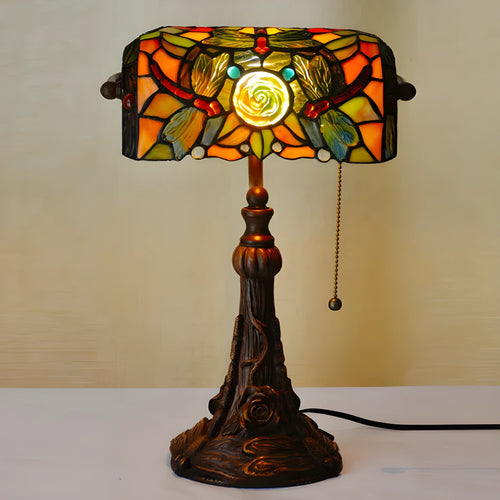 Tiffany stained glass table lamp with coloured glass shade on resin base for desk lighting