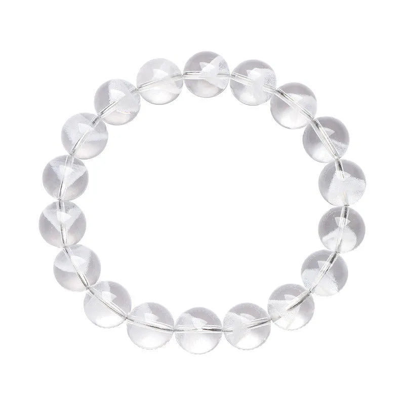 Women's natural white ghost pyramid crystal bracelet showing textured surfaces and ruyi charm detail