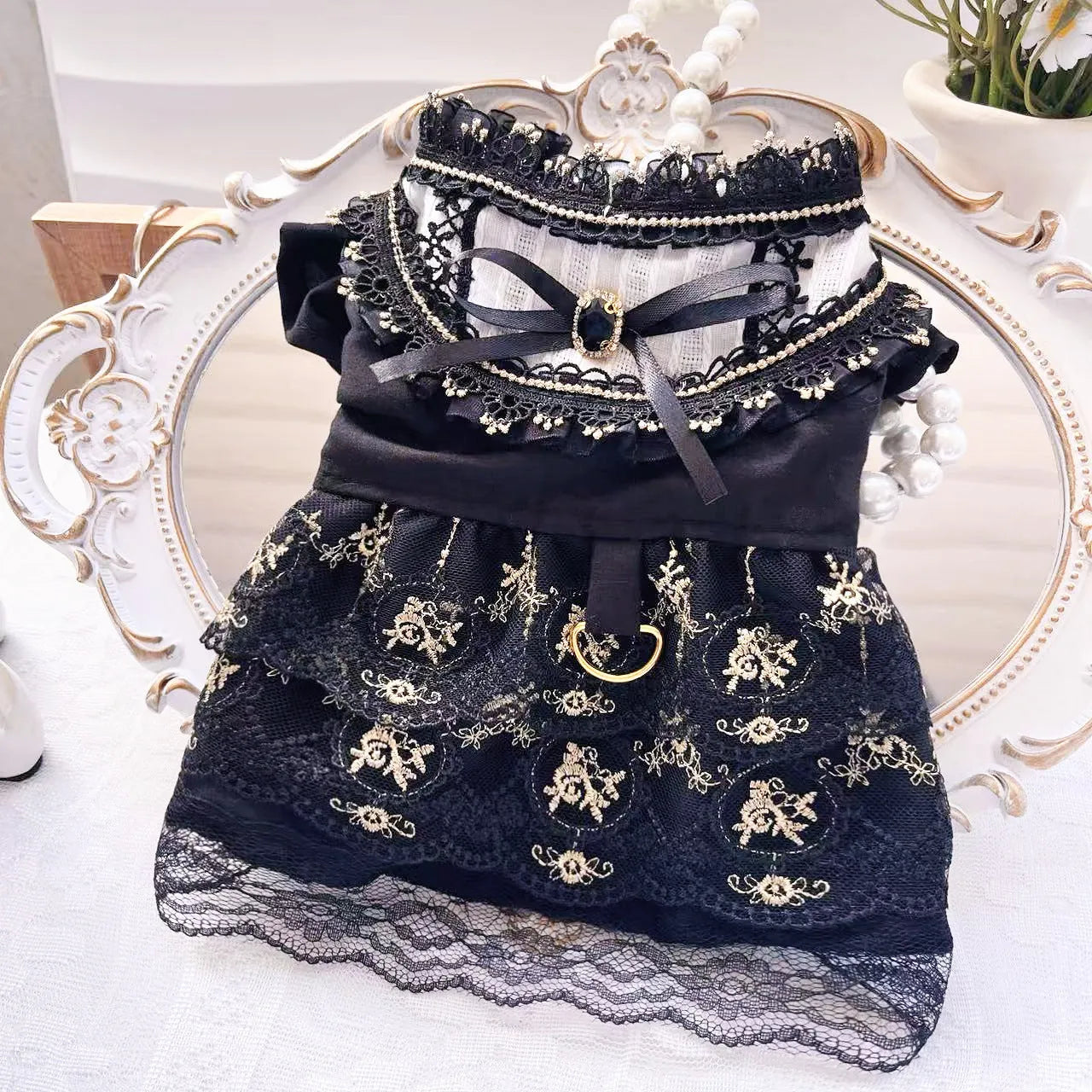 Golden gothic princess-style skirt for a small dog or cat on a mannequin.