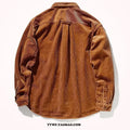 Loose long sleeve corduroy shirt in caramel colour, cardigan style, laid flat.