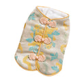 Red cheongsam pet vest with decorative knot buttons, floral and fruit patterns, for Lunar New Year