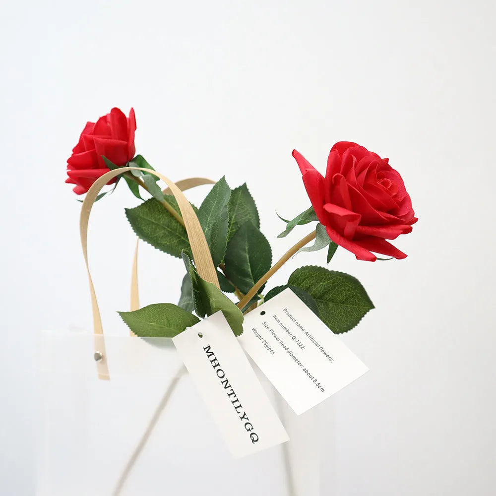 Artificial silk flower bouquet with red petals and green leaves measuring 42cm long