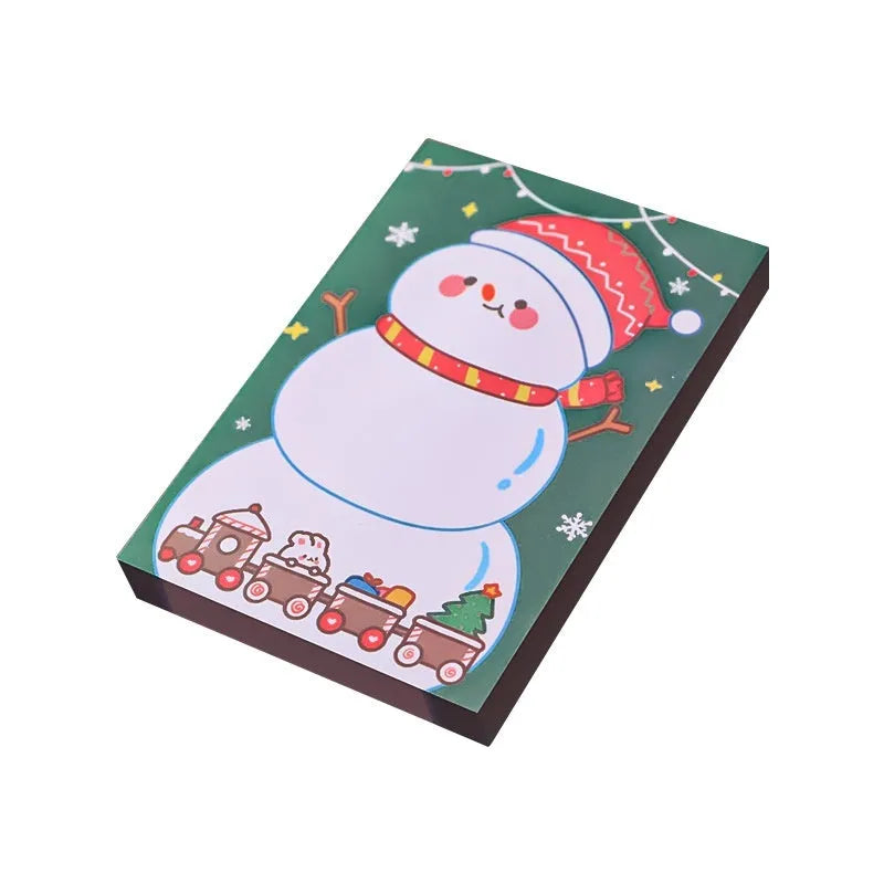 Christmas sticky notes book showing eight festive cartoon designs including elf, Santa, and snowman patterns