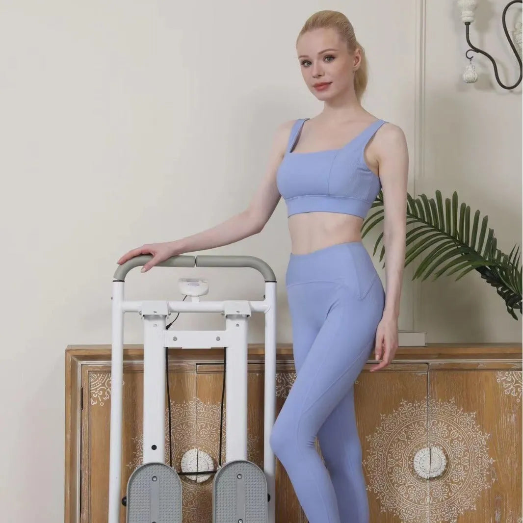 White foldable treadmill with attached climbing frame for home fitness