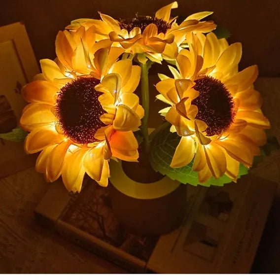 Rechargeable sunflower LED simulation night light with warm glow on a table