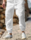 Men's straight leg linen trousers with elastic waist in Army Green colour on a hanger